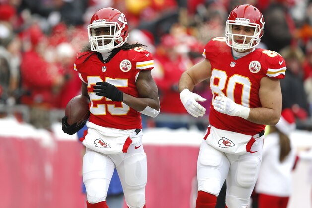 Kansas City Chiefs running back Jamaal Charles (25) celebrates a touchdown with Anthony Fasano (80) during the first half of an NFL football game at Arrowhead Stadium in Kansas City, Mo., Sunday, Dec. 22, 2013. (AP Photo/Orlin Wagner)