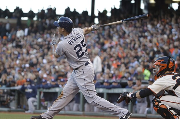 San Diego Padres' Will Venable hits a sacrifice fly off San Francisco Giants starting pitcher Tim Hudson in the third inning of their baseball game, Tuesday, June 24, 2014, in San Francisco. The Padres' Will Venable scored from third base on the play. (AP Photo/Eric Risberg)