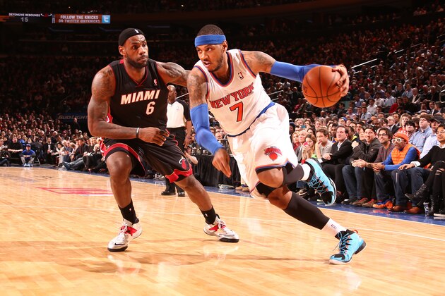 NEW YORK, NY - JANUARY 9: Carmelo Anthony #7 of the New York Knicks drives against LeBron James #6 of the Miami Heat during a game at Madison Square Garden in New York City on January 9, 2014.  NOTE TO USER: User expressly acknowledges and agrees that, by downloading and or using this photograph, User is consenting to the terms and conditions of the Getty Images License Agreement. Mandatory Copyright Notice: Copyright 2014 NBAE  (Photo by Nathaniel S. Butler/NBAE via Getty Images)