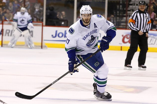 Vancouver Canucks' Ryan Kesler skates to the puck against the Phoenix Coyotes during the first period of an NHL hockey game on Tuesday, March 4, 2014, in Glendale, Ariz.  The Coyotes defeated the Canucks 1-0. (AP Photo/Ross D. Franklin)