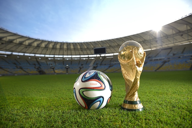 RIO DE JANEIRO, BRAZIL - DECEMBER 03:  A general view of Brazuca and the FIFA World Cup Trophy at the Maracana before the adidas Brazuca launch at Parque Lage on December 3, 2013 in Rio de Janeiro, Brazil. Brazuca is the Official Match Ball for the FIFA World Cup 2014 Brazil. Tonight adidas revealed brazuca to the world in the stunning setting of Parque Lage in Rio de Janeiro. The reveal was part of a spectacular light projection supported by global footballers Seedorf, Hernane and FIFA World Cup Winner Cafu. Hundreds of guests and celebrities were treated to this one off experience, which launched the Official FIFA World Cup Ball for Brazil 2014. For more information visit: news.adidas.com/worldcupOMB  (Photo by Alexandre Loureiro/Getty Images for adidas)