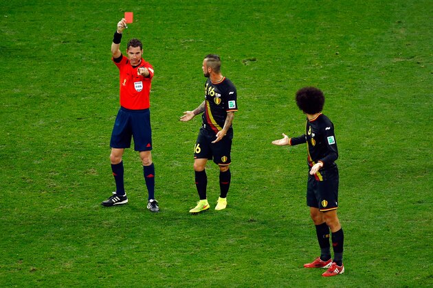 SAO PAULO, BRAZIL - JUNE 26:  Steven Defour and Marouane Fellaini  of Belgium protest to referee Benjamin Williams as he shows a red card to Defour during the 2014 FIFA World Cup Brazil Group H match between South Korea and Belgium at Arena de Sao Paulo on June 26, 2014 in Sao Paulo, Brazil.  (Photo by Matthew Lewis/Getty Images)