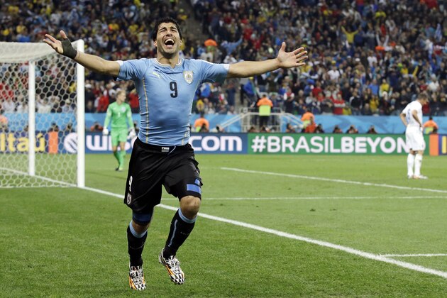 Uruguay's Luis Suarez celebrates after scoring his side's second goal during the group D World Cup soccer match between Uruguay and England at the Itaquerao Stadium in Sao Paulo, Brazil, Thursday, June 19, 2014.  (AP Photo/Matt Dunham)