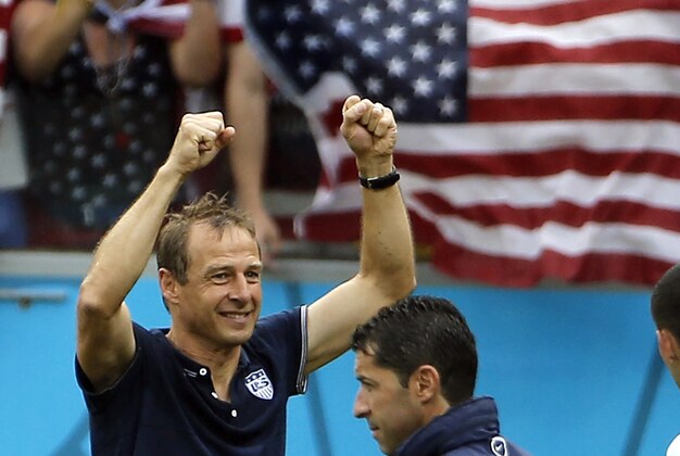 Jun 26, 2014; Recife, BRAZIL; United States manager Jurgen Klinsmann celebrates after finding out they had advanced past the group stage after their 1-0 loss to Germany at Arena Pernambuco. Mandatory Credit: Winslow Townson-USA TODAY Sports