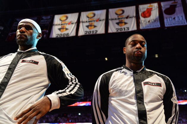 MIAMI, FL - JUNE 12: LeBron James #6 and Dwyane Wade #3 of of the Miami Heat look on against the San Antonio Spurs during Game Six of the 2014 NBA Finals on June 12, 2014 at American Airlines Arena in Miami, Florida. NOTE TO USER: User expressly acknowledges and agrees that, by downloading and or using this photograph, User is consenting to the terms and conditions of the Getty Images License Agreement. Mandatory Copyright Notice: Copyright 2014 NBAE (Photo by Jesse D. Garrabrant/NBAE via Getty Images)