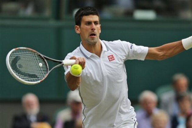 Novak Djokovic of Serbia returns to Radek Stepanek of Czech Republic during their men's singles match at the All England Lawn Tennis Championships in Wimbledon, London, Wednesday, June 25, 2014. (AP Photo/Ben Curtis)