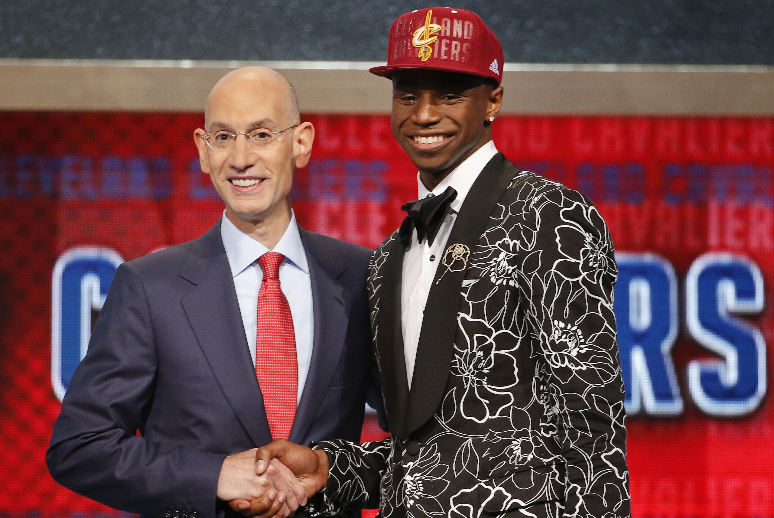 NBA Commissioner Adam Silver, left, congratulates Andrew Wiggins of Kansas who was selected by the Cleveland Cavaliers as the number one pick in the 2014 NBA draft, Thursday, June 26, 2014, in New York. (AP Photo/Jason DeCrow)