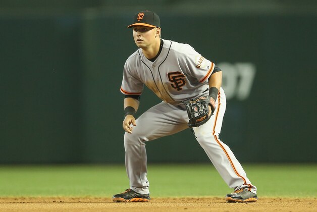 PHOENIX, AZ - JUNE 22:  Infielder Joe Panik #12 of the San Francisco Giants in action during the MLB game against the Arizona Diamondbacks at Chase Field on June 22, 2014 in Phoenix, Arizona. The Giants defeated the Diamondbacks 4-1.  (Photo by Christian Petersen/Getty Images)