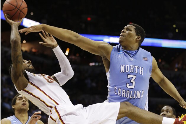 Iowa State guard DeAndre Kane (50) tries to shoot as North Carolina forward Kennedy Meeks (3) defends during the second half of a third-round game in the NCAA college basketball tournament Sunday, March 23, 2014, in San Antonio. (AP Photo/David J. Phillip)