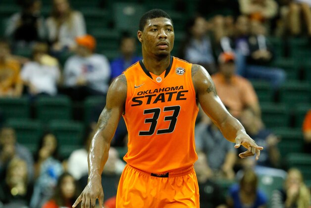 ORLANDO, FL - DECEMBER 01:  Marcus Smart #33 of the Oklahoma State Cowboys sets up the offense in a game against the Memphis Tigers during the Old Spice Classic at HP Field House on December 1, 2013 in Orlando, Florida.  (Photo by Sam Greenwood/Getty Images)