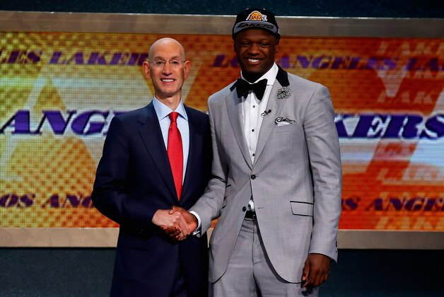 NEW YORK, NY - JUNE 26: Julius Randle (R) of Kentucky shakes hands NBA Commissioner Adam Silver after being selected with the #7 overall pick by the Los Angeles Lakers during the 2014 NBA Draft at Barclays Center on June 26, 2014 in the Brooklyn borough of New York City. NOTE TO USER: User expressly acknowledges and agrees that, by downloading and/or using this Photograph, user is consenting to the terms and conditions of the Getty Images License Agreement. (Photo by Mike Stobe/Getty Images)
