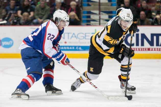 WINDSOR, ON - JANUARY 30: Roland McKeown #20 of the Kingston Frontenacs drives past Sam Povorozniouk #22 of the Windsor Spitfires on January 30, 2014 at the WFCU Centre in Windsor, Ontario, Canada. (Photo by Dennis Pajot/Getty Images) WINDSOR, ON - JANUARY 30: Roland McKeown #20 of the Kingston Frontenacs drives past Sam Povorozniouk #22 of the Windsor Spitfires on January 30, 2014 at the WFCU Centre in Windsor, Ontario, Canada. (Photo by Dennis Pajot/Getty Images)
