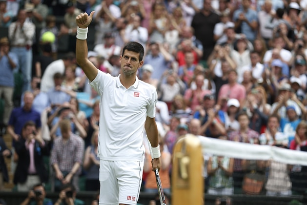 Novak Djokovic of Serbia celebrates after winning his first round match against Andrey Golubev of Kazakhstan at the All England Lawn Tennis Championships in Wimbledon, London, Monday, June 23, 2014. (AP Photo/Pavel Golovkin) Novak Djokovic of Serbia celebrates after winning his first round match against Andrey Golubev of Kazakhstan at the All England Lawn Tennis Championships in Wimbledon, London, Monday, June 23, 2014. (AP Photo/Pavel Golovkin)