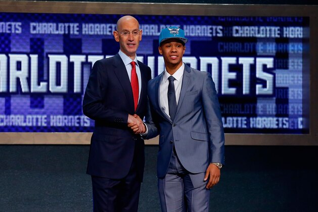 NEW YORK, NY - JUNE 26:  Shabazz Napier of Connecticut (R) shakes hands with NBA Commissioner Adam Silver after being drafted with the #24 overall pick by the Charlotte Hornets during the 2014 NBA Draft at Barclays Center on June 26, 2014 in the Brooklyn borough of New York City. NOTE TO USER: User expressly acknowledges and agrees that, by downloading and/or using this Photograph, user is consenting to the terms and conditions of the Getty Images License Agreement.  (Photo by Mike Stobe/Getty Images)