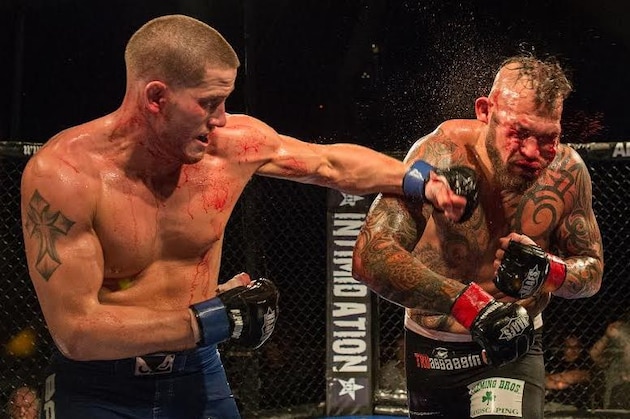 Josh Stansbury (left) lands a punch on John Hawk.