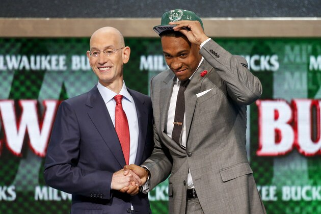 Jabari Parker of Duke poses for a photo with NBA Commissioner Adam Silver after being selected by the Milwaukee Bucks as the number two overall pick during the 2014 NBA draft, Thursday, June 26, 2014, in New York. (AP Photo/Jason DeCrow)