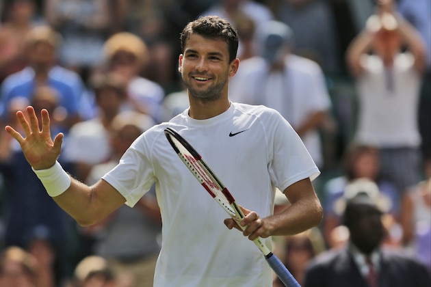 Grigor Dimitrov of Bulgaria waves to the crowd after he defeats Luke Saville of Australia during their men's singles match at the All England Lawn Tennis Championships in Wimbledon, London, Wednesday, June 25, 2014. (AP Photo/Ben Curtis)