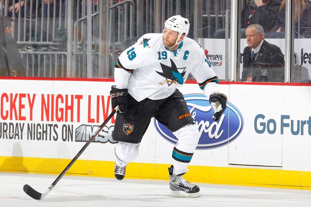 NEWARK, NJ - MARCH 02:  Joe Thornton #19 of the San Jose Sharks in action against the New Jersey Devils at the Prudential Center on March 2, 2014 in Newark, New Jersey. The Sharks defeated the Devils 4-2.  (Photo by Jim McIsaac/Getty Images)