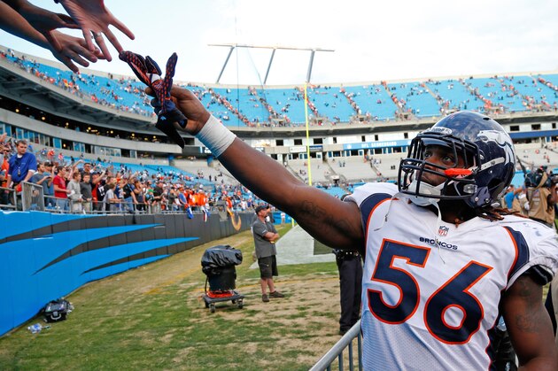 Denver Broncos' Nate Irving (56) shares some gloves with some fans after the Broncos beat the Carolina Panthers 36-14 in an NFL football game in Charlotte, N.C., Sunday, Nov. 11, 2012. (AP Photo/Bob Leverone) Denver Broncos' Nate Irving (56) shares some gloves with some fans after the Broncos beat the Carolina Panthers 36-14 in an NFL football game in Charlotte, N.C., Sunday, Nov. 11, 2012. (AP Photo/Bob Leverone)