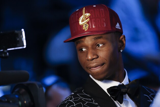 Andrew Wiggins of Kansas stops for a television interview after being selected by the Cleveland Cavaliers as the number one pick in the 2014 NBA draft, Thursday, June 26, 2014, in New York. (AP Photo/Kathy Willens)