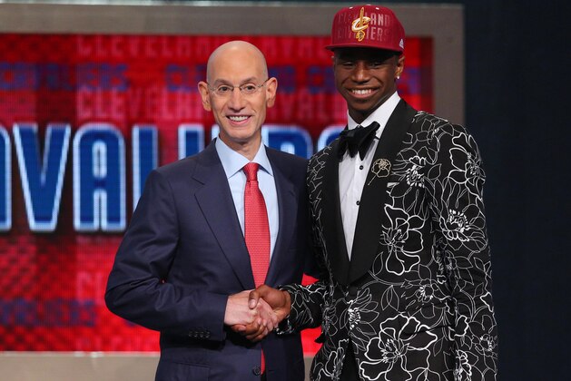 Jun 26, 2014; Brooklyn, NY, USA; Andrew Wiggins (Kansas) shakes hands with NBA commissioner Adam Silver after being selected as the number one overall pick to the Cleveland Cavaliers in the 2014 NBA Draft at the Barclays Center. Mandatory Credit: Brad Penner-USA TODAY Sports