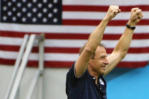 Jun 26, 2014; Recife, BRAZIL; United States manager Jurgen Klinsmann celebrates after finding out they had advanced past the group stage after their 1-0 loss to Germany at Arena Pernambuco. Mandatory Credit: Winslow Townson-USA TODAY Sports