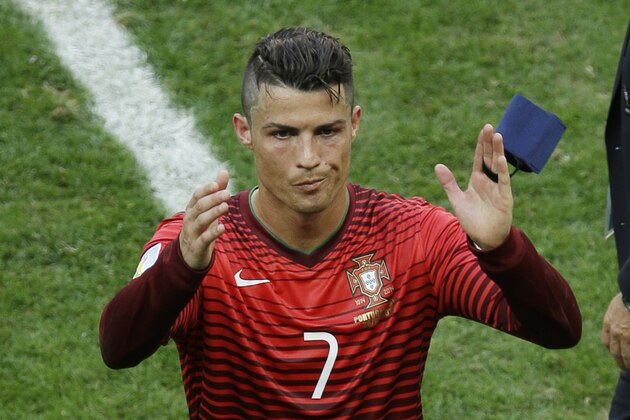 Portugal's Cristiano Ronaldo waves as he leaves the pitch following the group G World Cup soccer match between Portugal and Ghana at the Estadio Nacional in Brasilia, Brazil, Thursday, June 26, 2014. Portugal won 2-1. (AP Photo/Themba Hadebe)