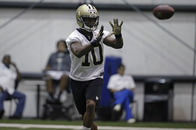 New Orleans Saints first round draft pick Brandin Cooks (10) works out during OTA workouts at their NFL football training facility in Metairie, La., Thursday, June 19, 2014. (AP Photo/Gerald Herbert)