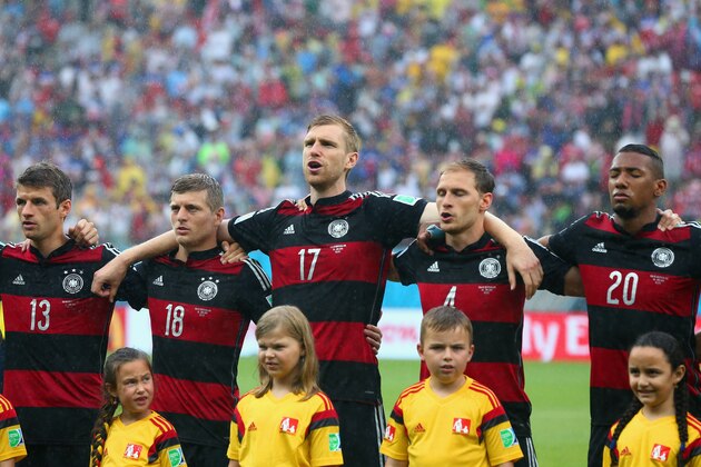 RECIFE, BRAZIL - JUNE 26:  (L-R) Thomas Mueller, Toni Kroos, Per Mertesacker, Benedikt Hoewedes and Jerome Boateng of Germany look on during the National Anthem prior to the 2014 FIFA World Cup Brazil group G match between the United States and Germany at Arena Pernambuco on June 26, 2014 in Recife, Brazil.  (Photo by Martin Rose/Getty Images)