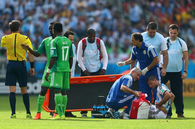 PORTO ALEGRE, BRAZIL - JUNE 25: Sergio Aguero of Argentina receives treatment during the 2014 FIFA World Cup Brazil Group F match between Nigeria and Argentina at Estadio Beira-Rio on June 25, 2014 in Porto Alegre, Brazil.  (Photo by Jeff Gross/Getty Images)