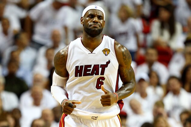 MIAMI, FL - JUNE 12:  LeBron James #6 of the Miami Heat reacts against the San Antonio Spurs during Game Four of the 2014 NBA Finals at American Airlines Arena on June 12, 2014 in Miami, Florida. NOTE TO USER: User expressly acknowledges and agrees that, by downloading and or using this photograph, User is consenting to the terms and conditions of the Getty Images License Agreement.  (Photo by Andy Lyons/Getty Images)