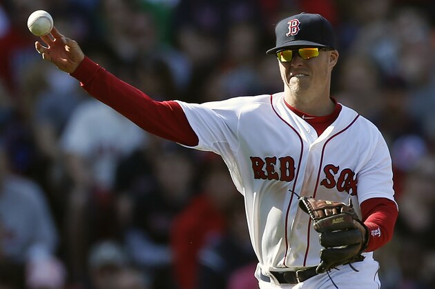 Boston Red Sox's Brock Holt throws to first base on a ground out by Baltimore Orioles' Nelson Cruz in the eighth inning of a  baseball game in Boston, Saturday, April 19, 2014. (AP Photo/Michael Dwyer)