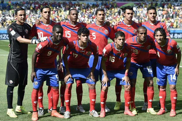Costa Rica players pose for pictures before  the group D World Cup soccer match between Costa Rica and England at the Mineirao Stadium in Belo Horizonte, Brazil, Tuesday, June 24, 2014. (AP Photo/Martin Meissner)