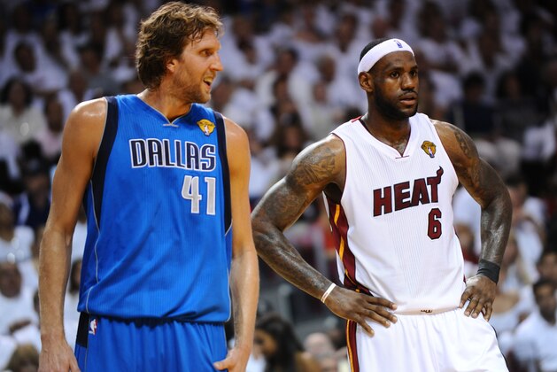MIAMI, FL - JUNE 12: LeBron James #6 of the Miami Heat and Dirk Nowitzki #41 of the Dallas Mavericks during a break in the action of Game Six of the 2011 NBA Finals on June 12, 2011 at the American Airlines Arena in Miami, Florida. NOTE TO USER: User expressly acknowledges and agrees that, by downloading and/or using this photograph, user is consenting to the terms and conditions of the Getty Images License Agreement.  Mandatory Copyright Notice: Copyright 2011 NBAE (Photo by Garrett Ellwood/NBAE via Getty Images)