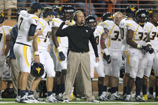 Oct 6, 2012; Austin, TX, USA; West Virginia Mountaineers head coach  Dana Holgorsen calls a play during the fourth quarter against the Texas Longhorns at Darrell K Royal-Texas Memorial Stadium. West Virginia beat Texas 48-45. Mandatory Credit: Tim Heitman-USA TODAY Sports