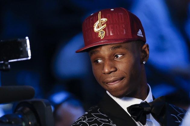 Andrew Wiggins of Kansas stops for a television interview after being selected by the Cleveland Cavaliers as the number one pick in the 2014 NBA draft, Thursday, June 26, 2014, in New York. (AP Photo/Kathy Willens)