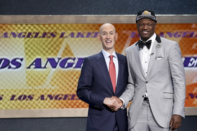 Kentucky forward Julius Randle, right, poses for a photo with NBA commissioner Adam Silver after being selected seventh overall by the Los Angeles Lakers during the 2014 NBA draft, Thursday, June 26, 2014, in New York. (AP Photo/Kathy Willens)