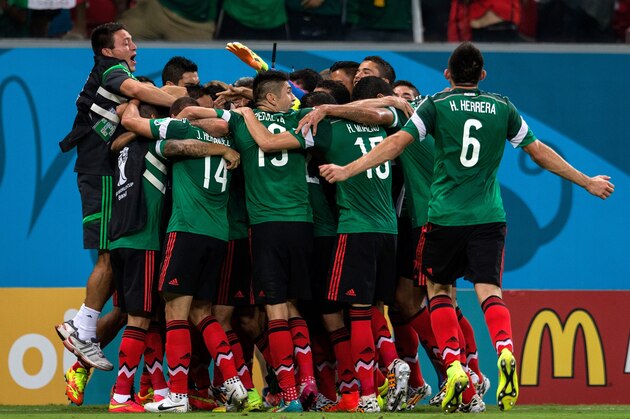 RECIFE, BRAZIL - JUNE 23:  Rafael Marquez of Mexico celebrates with teammates scoring his team's first goal during the 2014 FIFA World Cup Brazil Group A match between Croatia and Mexico at Arena Pernambuco on June 23, 2014 in Recife, Brazil.  (Photo by Miguel Tovar/Getty Images)