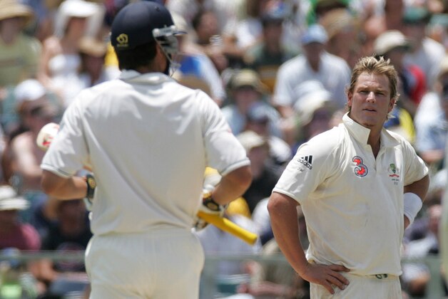 Australia's Shane Warne right, gives England's Alastair Cook a look after he was hit for four runs during the 3rd Ashes test match in Perth, Western Australia, Sunday, Dec. 17, 2006.  England is defending the Ashes in a five test series with Australia leading 2-0 after defeating the visitors in Brisbane and Adelaide.(AP Photo/Rob Griffith)**MOBILES OUT EDITORIAL USE ONLY**