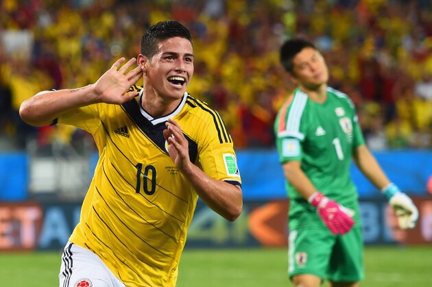 CUIABA, BRAZIL - JUNE 24:  James Rodriguez of Colombia celebrates scoring his team's fourth goal past goalkeeper Eiji Kawashima of Japan during the 2014 FIFA World Cup Brazil Group C match between Japan and Colombia at Arena Pantanal on June 24, 2014 in Cuiaba, Brazil.  (Photo by Christopher Lee/Getty Images)
