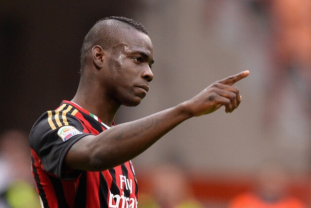 MILAN, ITALY - APRIL 19:  Mario Balotelli of AC Milan celebrates scoring the first goal during the Serie A match between AC Milan and AS Livorno Calcio at San Siro Stadium on April 19, 2014 in Milan, Italy.  (Photo by Claudio Villa/Getty Images)