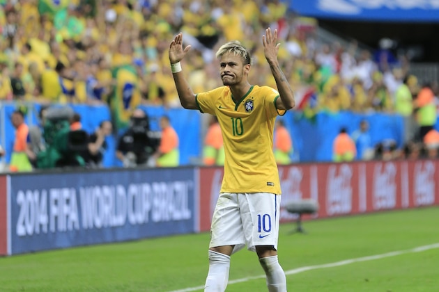 Brazil's Neymar celebrates after scoring his side's second goal during the group A World Cup soccer match between Cameroon and Brazil at the Estadio Nacional in Brasilia, Brazil, Monday, June 23, 2014. (AP Photo/Bernat Armangue)