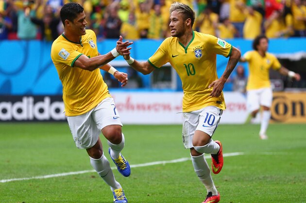 BRASILIA, BRAZIL - JUNE 23: Neymar of Brazil (R) celebrates scoring his team's first goal with Hulk  during the 2014 FIFA World Cup Brazil Group A match between Cameroon and Brazil at Estadio Nacional on June 23, 2014 in Brasilia, Brazil.  (Photo by Clive Brunskill/Getty Images)