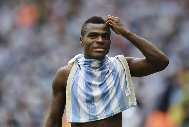 Nigeria's Emmanuel Emenike walks off the pitch with an Argentina jersey during the group F World Cup soccer match between Nigeria and Argentina at the Estadio Beira-Rio in Porto Alegre, Brazil, Wednesday, June 25, 2014. (AP Photo/Martin Meissner)