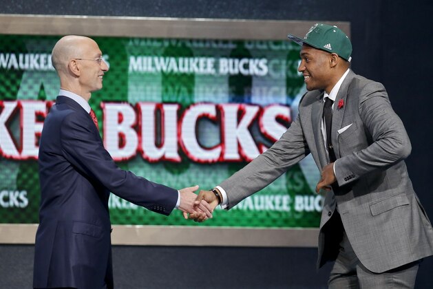 Jabari Parker of Duke is greeted by NBA Commissioner Adam Silver after being selected by the Milwaukee Bucks as the number two overall pick during the 2014 NBA draft, Thursday, June 26, 2014, in New York. (AP Photo/Kathy Willens)