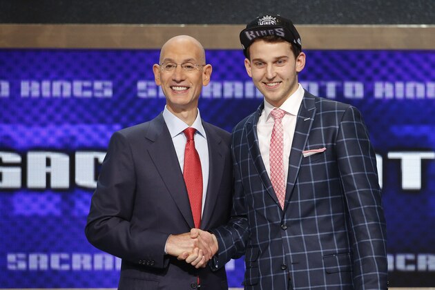 Nik Stauskas, right, poses for a photo with NBA Commissioner Adam Silver after being selected eighth overall by the Sacramento Kings during the 2014 NBA draft, Thursday, June 26, 2014, in New York. (AP Photo/Jason DeCrow)