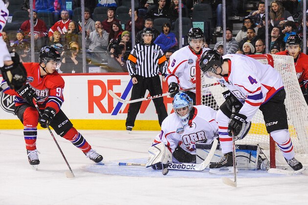 CALGARY, AB - JANUARY 15: Brycen Martin #4 and Julio Billia #30 of Team Orr defend net against Nikolay Goldobin #90 of Team Cherry during the CHL Top Prospects game at Scotiabank Saddledome on January 15, 2014 in Calgary, Alberta, Canada. (Photo by Derek Leung/Getty Images)