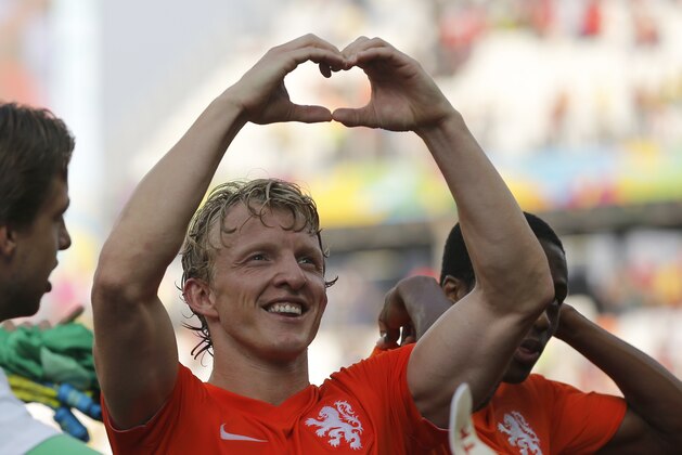Netherlands' Dirk Kuyt forms a heart with his hands after the group B World Cup soccer match between the Netherlands and Chile at the Itaquerao Stadium in Sao Paulo, Brazil, Monday, June 23, 2014. The Dutch team beat Chile 2-0 to top Group B. (AP Photo/Frank Augstein) Netherlands' Dirk Kuyt forms a heart with his hands after the group B World Cup soccer match between the Netherlands and Chile at the Itaquerao Stadium in Sao Paulo, Brazil, Monday, June 23, 2014. The Dutch team beat Chile 2-0 to top Group B. (AP Photo/Frank Augstein)