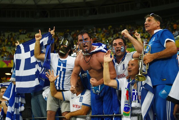 FORTALEZA, BRAZIL - JUNE 24:  Greece fans celebrate during the 2014 FIFA World Cup Brazil Group C match between Greece and the Ivory Coast at Castelao on June 24, 2014 in Fortaleza, Brazil.  (Photo by Laurence Griffiths/Getty Images)