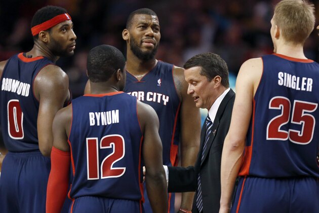 Detroit Pistons head coach John Loyer talks with his team during a timeout in the fourth quarter of an NBA basketball game against the Boston Celtics in Boston, Sunday, March 9, 2014. The Celtics won 118-111. (AP Photo/Michael Dwyer)